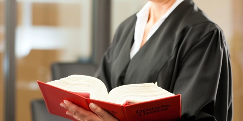 Judge holding a book