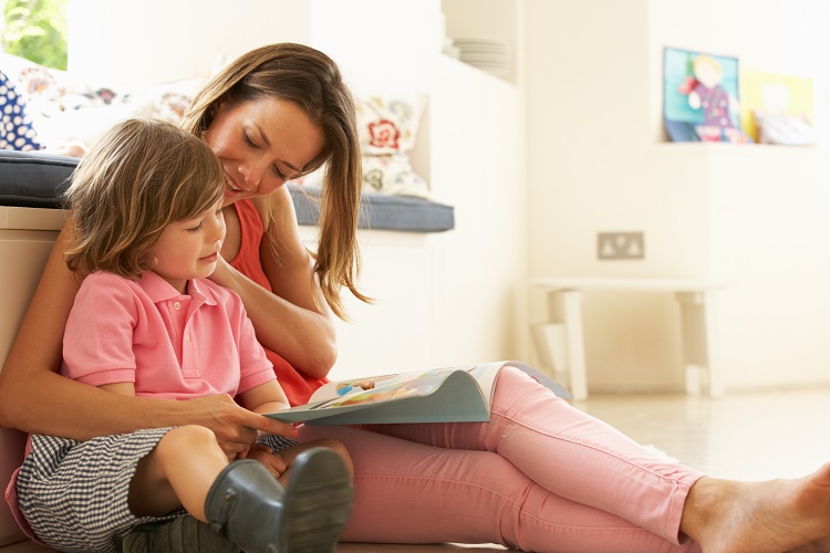 A mother reading to her daughter